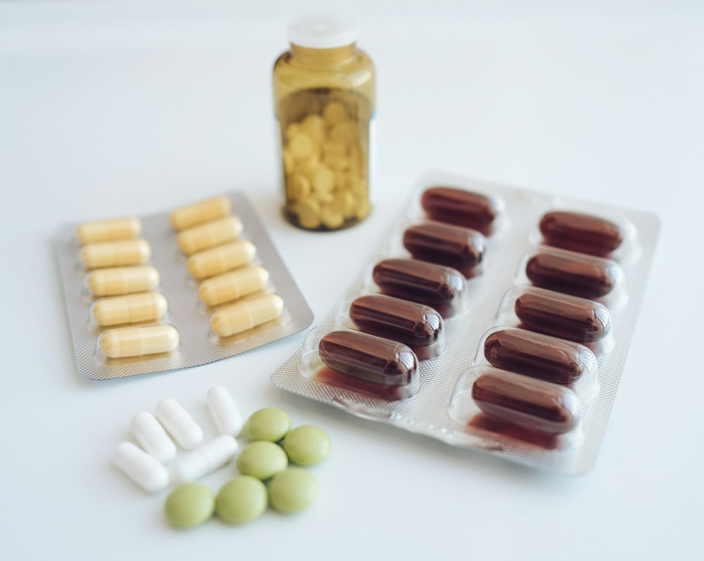 Assorted pills on a white background