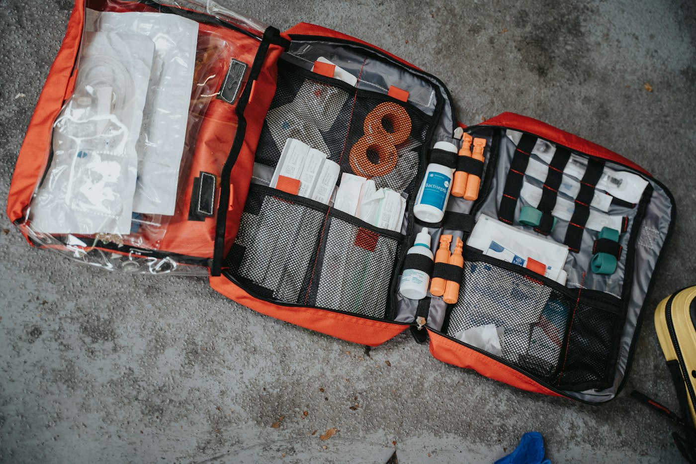 Open red medical bag with supplies